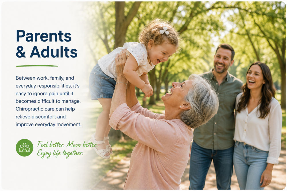 Grandmother lifting toddler while family laughs together in a tree lined park
