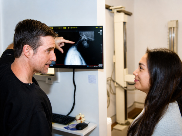 Dr. Richard Collin speaking with a patient about numbness tingling and nerve symptoms in Buford Georgia